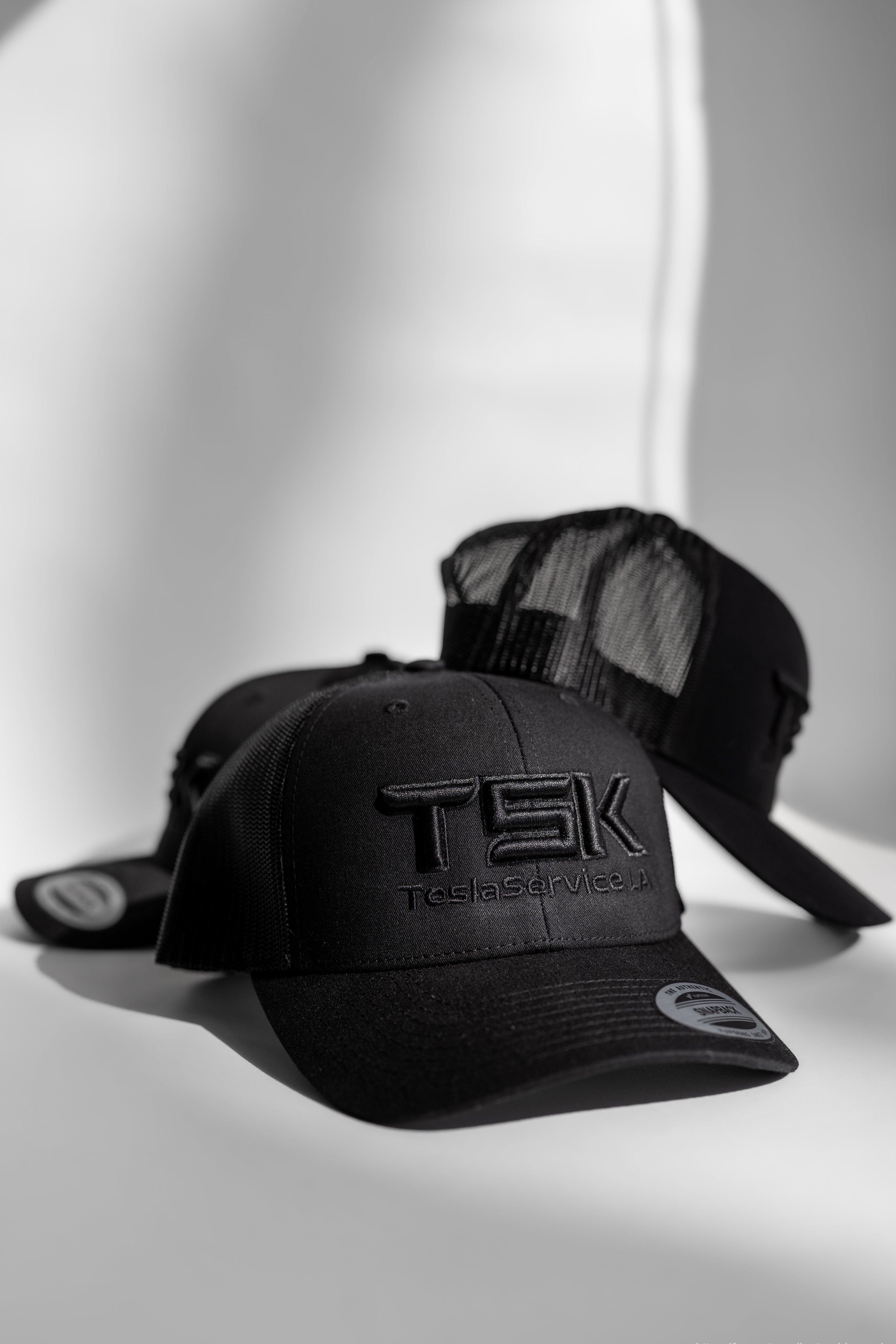 TSK TeslaService.LA Black Trucker Hat