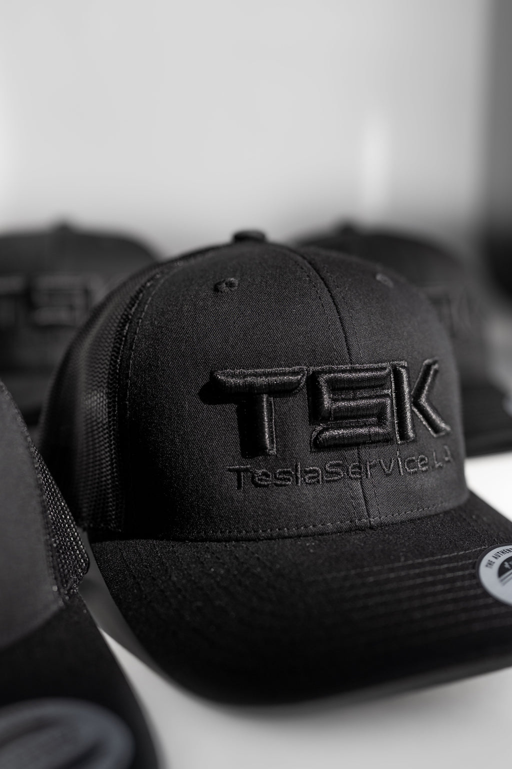TSK TeslaService.LA Black Trucker Hat