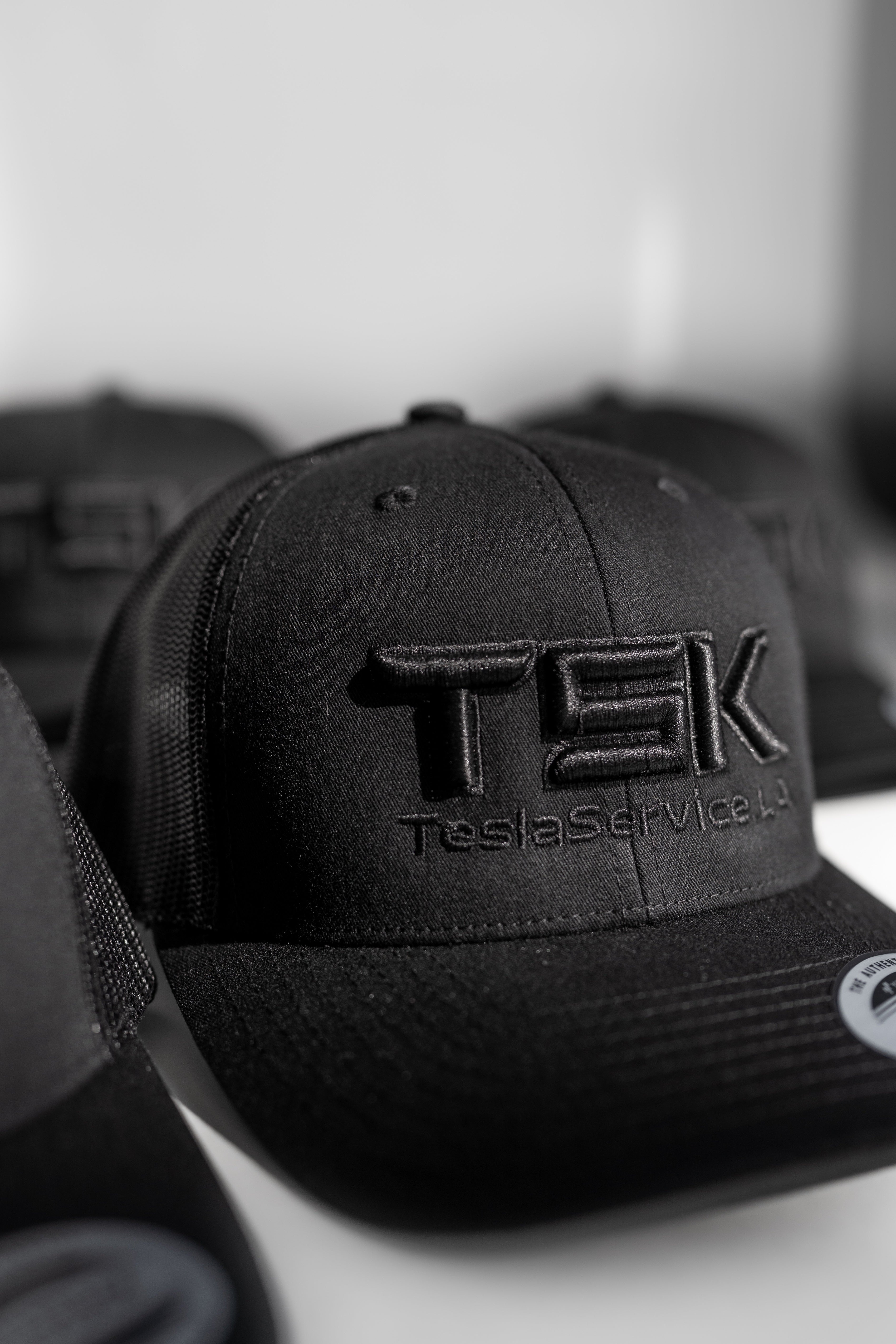 TSK TeslaService.LA Black Trucker Hat